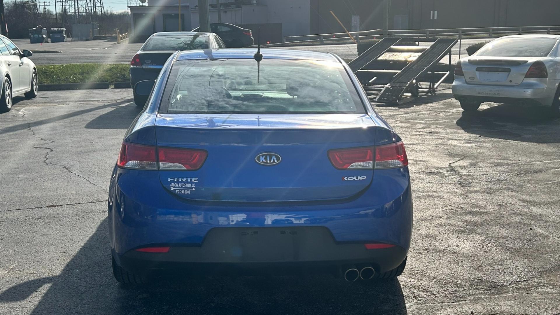 2011 Blue /BLACK Kia Forte Koup SX (KNAFW6A35B5) with an 2.4L L4 DOHC 16V engine, located at 2710A Westlane Rd., Indianapolis, IN, 46268, (317) 291-2000, 39.885670, -86.208160 - Photo#2